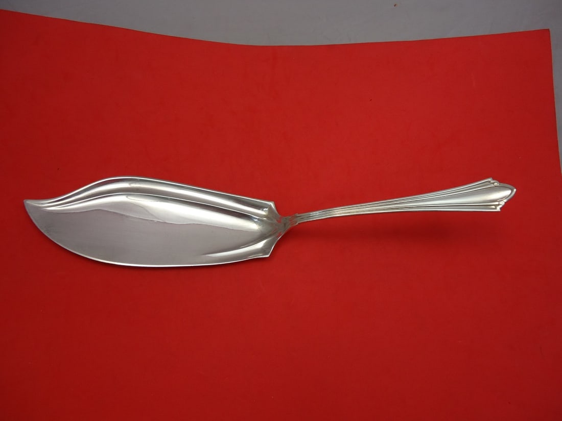 International Sterling Silver Fish Server 12in Westminster Pattern: International Sterling Silver Fish Server 12in Westminster Pattern This exquisite fish server is crafted from sterling silver and features the elegant Westminster pattern by International. Measuring 1