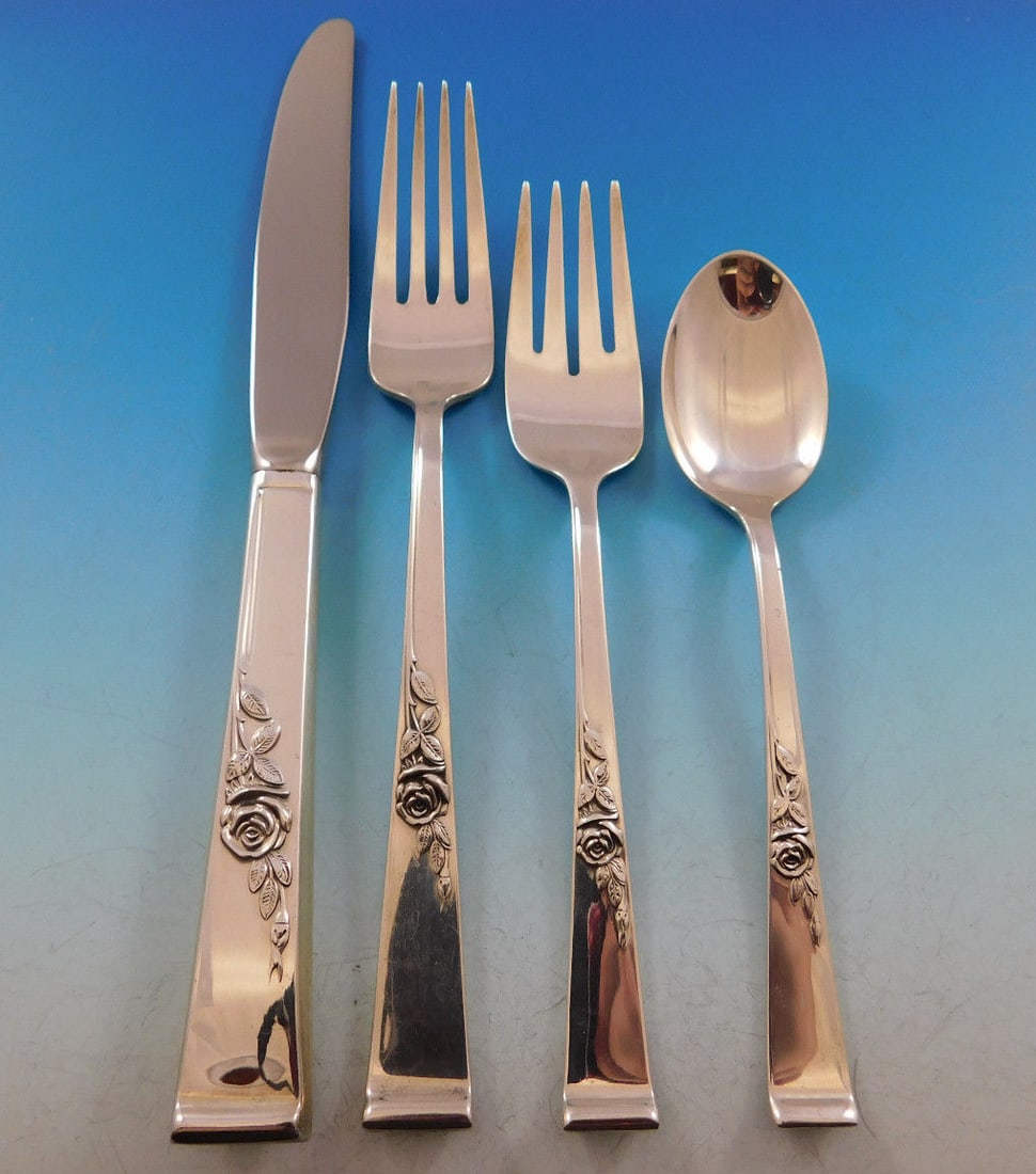 Reed & Barton Classic Rose Sterling Silver Flatware Set for 12 54 pcs: Reed & Barton Classic Rose Sterling Silver Flatware Set for 12 54 pcs Elevate your dining experience with the Classic Rose sterling silver flatware set by Reed & Barton. This exquisite post-1940 set i