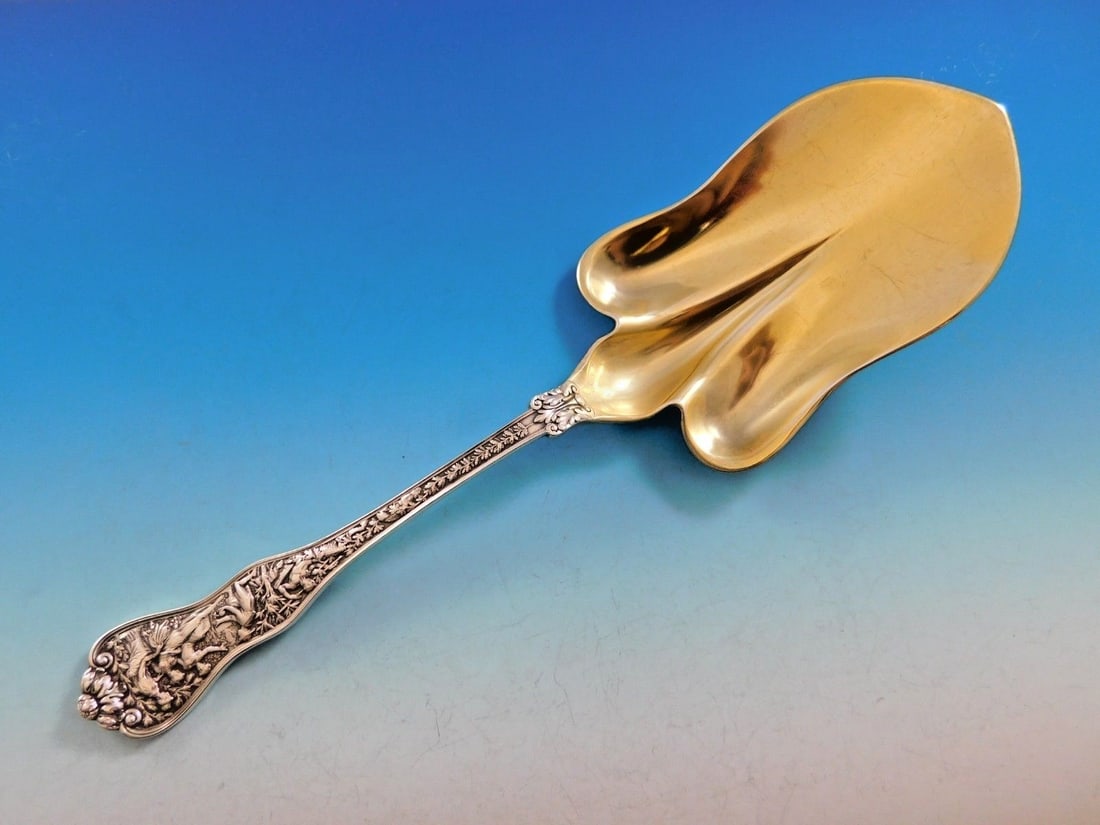 Tiffany & Co Olympian Sterling Silver Pastry Server 10 3/4" Gold Washed Spade Shape: Tiffany & Co Olympian Sterling Silver Pastry Server 10 3/4" Gold Washed Spade Shape Introducing the exquisite Olympian Pastry Server by Tiffany & Co., crafted from high-quality sterling silver. This s