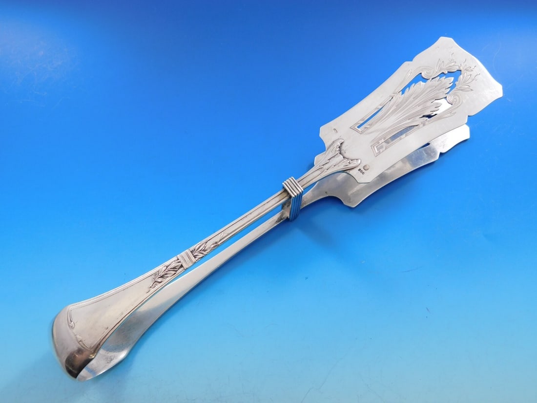 Austrian .800 Silver 10 Inch Pierced Asparagus Serving Tong: Austrian .800 Silver 10 Inch Pierced Asparagus Serving Tong This exquisite asparagus serving tong showcases the elegance of Austrian craftsmanship, crafted from .800 silver. The tong features a beauti