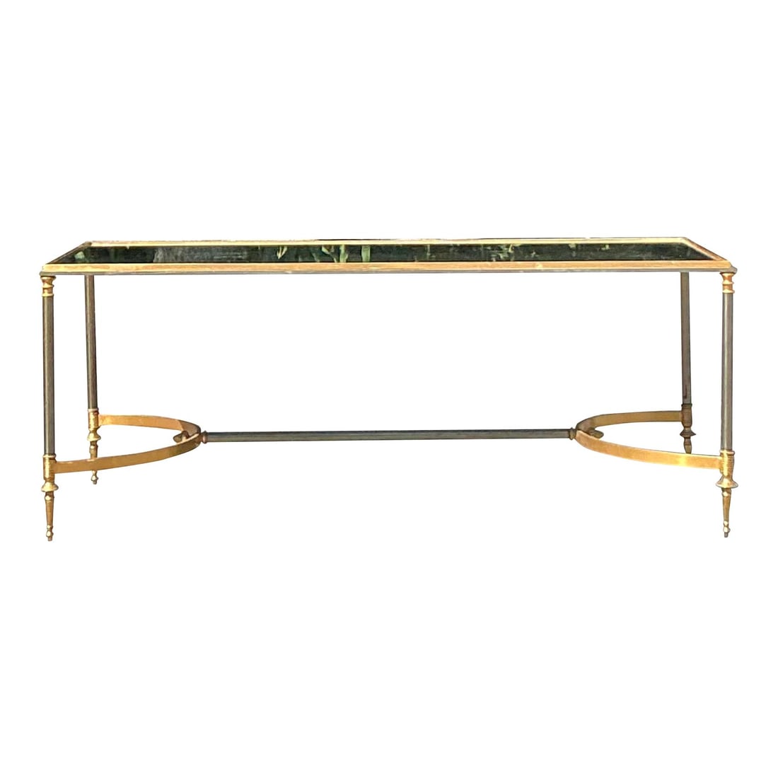 Vintage Maison Jansen Inspired Brass Coffee Table with Antiqued Mirror Top: Vintage Maison Jansen Inspired Brass Coffee Table with Antiqued Mirror Top This exquisite vintage coffee table, inspired by the renowned designs of Maison Jansen, exudes timeless Regency elegance. The