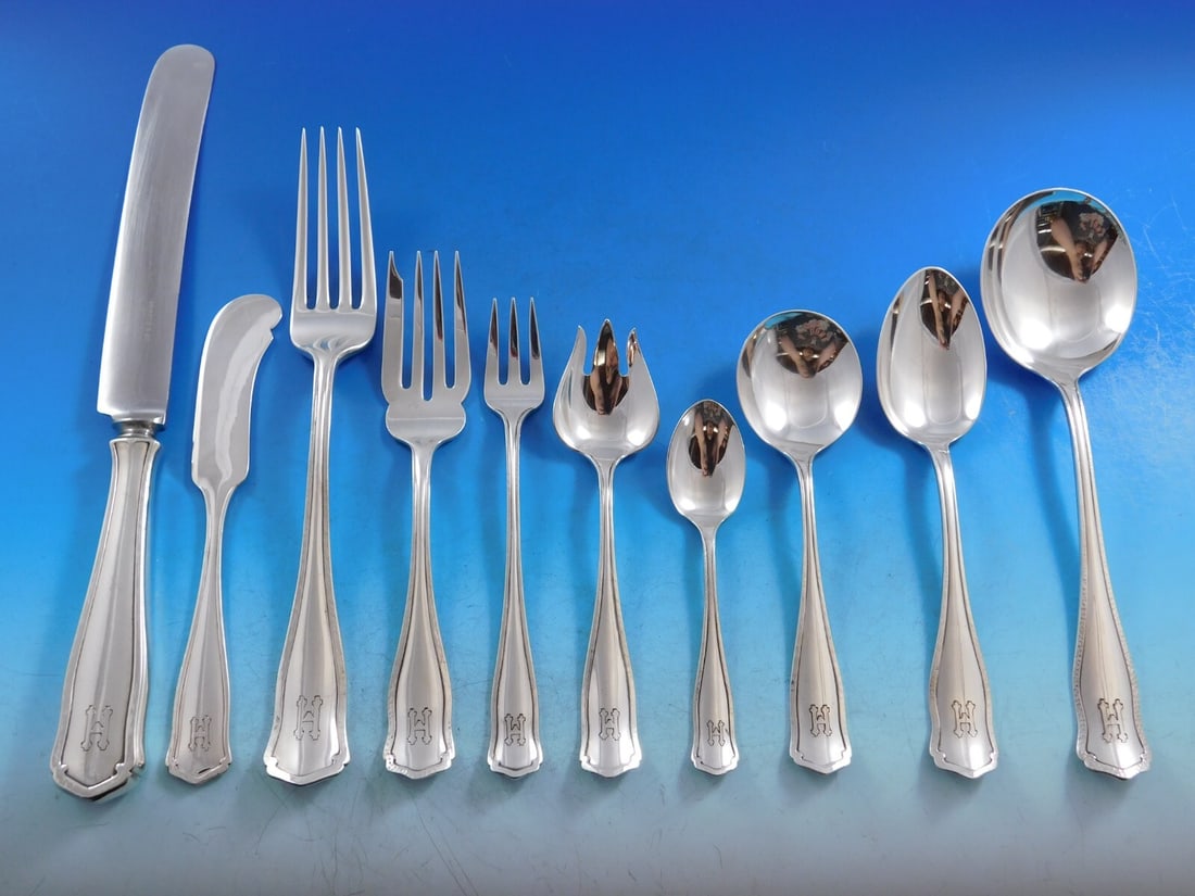 Shreve & Co Dolores Sterling Silver Flatware Set 71 pcs with H Monogram: Shreve & Co Dolores Sterling Silver Flatware Set 71 pcs with H Monogram Elevate your dining experience with the exquisite Dolores sterling silver flatware service set by Shreve & Co. This 71-piece set