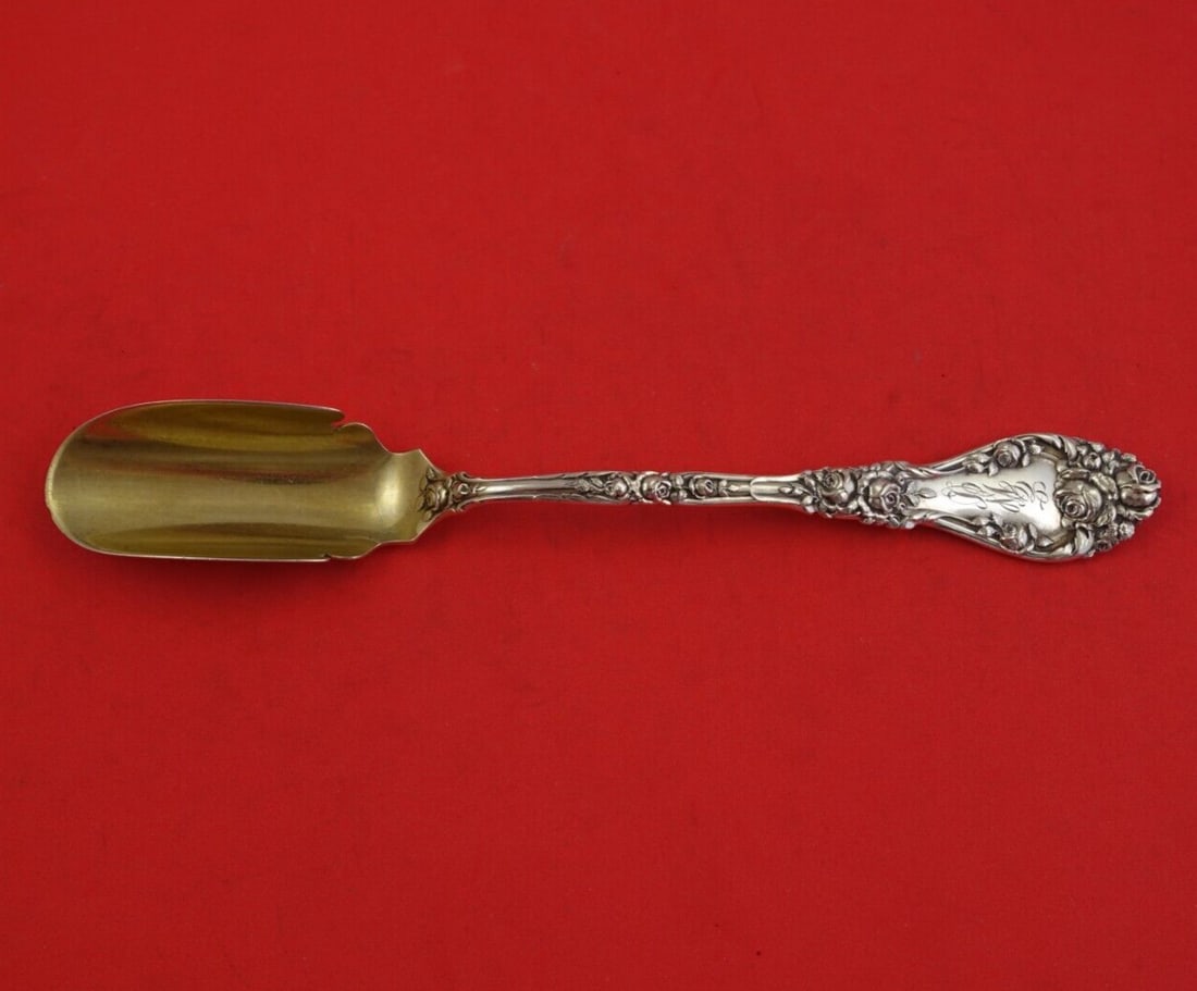Durgin Marechal Niel Sterling Silver Cheese Scoop Gold Washed 8.5 inches: Durgin Marechal Niel Sterling Silver Cheese Scoop Gold Washed 8.5 inches This exquisite cheese scoop is crafted from sterling silver (.925) in the elegant Marechal Niel pattern by Durgin. Measuring 8