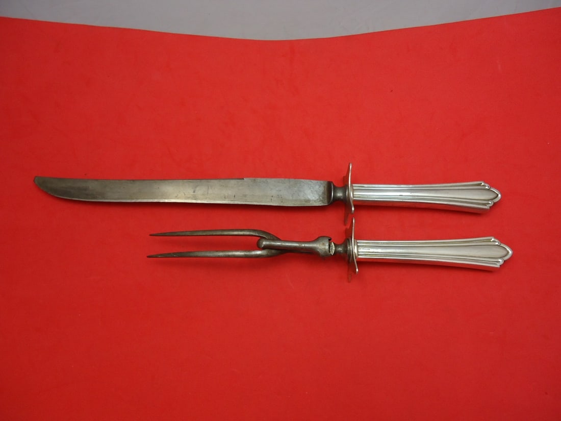 International Westminster Sterling Silver Steak Carving Set 2pc 12.5": International Westminster Sterling Silver Steak Carving Set 2pc 12.5" This exquisite two-piece steak carving set features a hollow handle design crafted from sterling silver, complemented by stainless