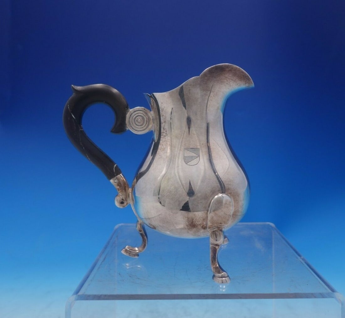 Jezler Swiss .800 Silver Creamer with Ebony Handle Vintage: Jezler Swiss .800 Silver Creamer with Ebony Handle Vintage This exquisite creamer, crafted by Jezler in Switzerland, showcases a stunning combination of .800 silver and an elegant ebony handle. Measur