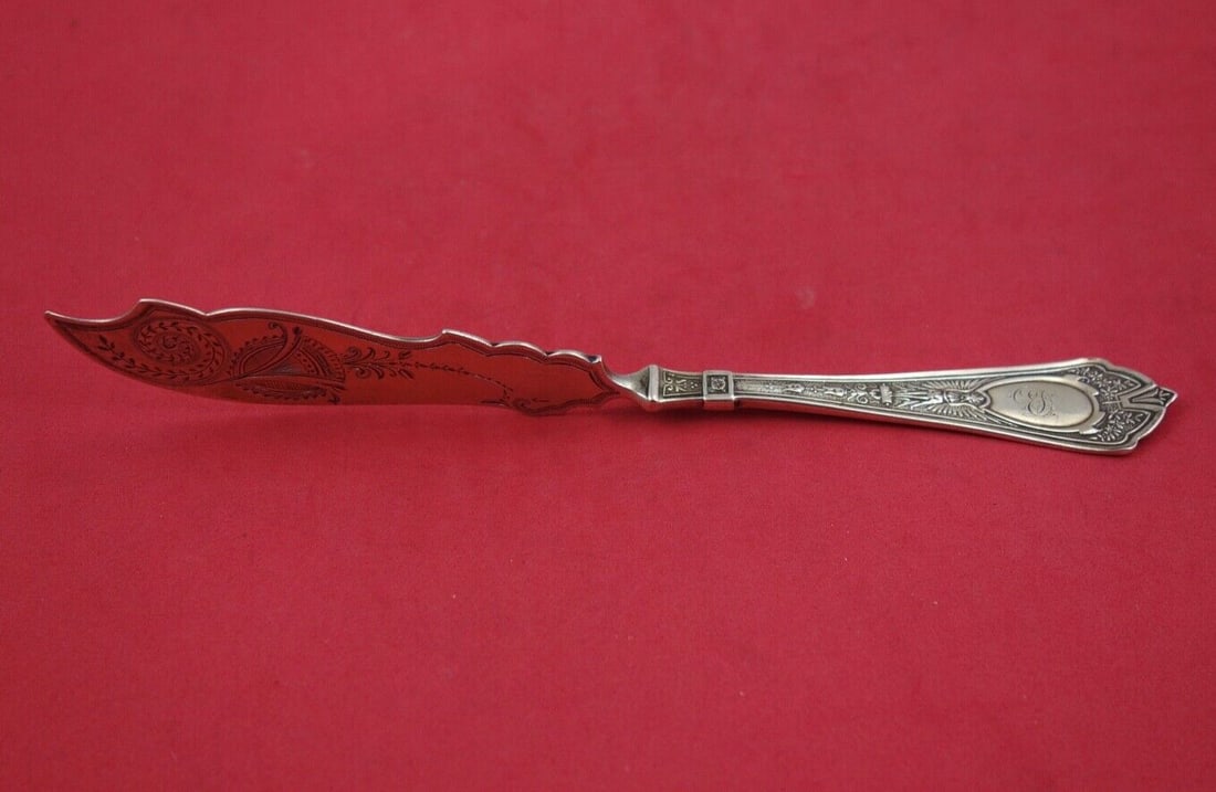 Schulz & Fischer Cleopatra Sterling Silver Master Butter Knife 7 3/4": Schulz & Fischer Cleopatra Sterling Silver Master Butter Knife 7 3/4" This exquisite 7 3/4" master butter knife is part of the Cleopatra pattern by Schulz & Fischer, crafted from high-quality sterling