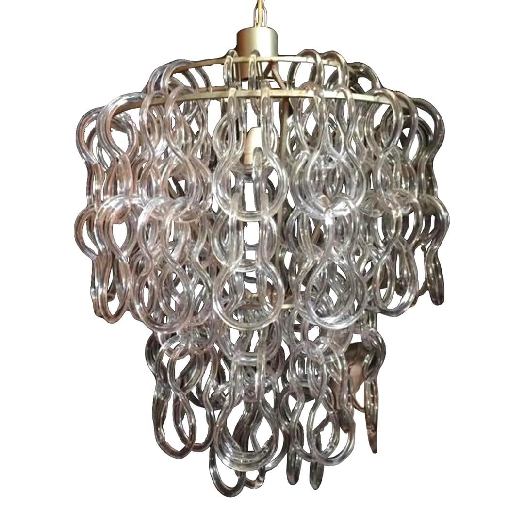 1970s Giogali 50 Chandelier by Angelo Mangiarotti Italy Murano Glass: 1970s Giogali 50 Chandelier by Angelo Mangiarotti Italy Murano Glass This stunning 1970s Vintage Giogali 50 Murano Glass Loop Chandelier features exquisite hand-blown Murano glass loops that intricate