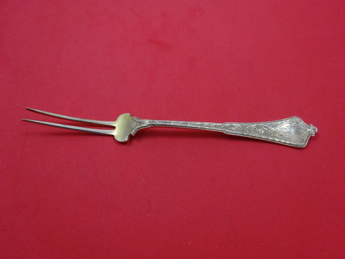 Tiffany & Co. Persian Sterling Fruit Fork Light Goldwashed 6 3/8": Tiffany & Co. Persian Sterling Fruit Fork Light Goldwashed 6 3/8" This exquisite fruit fork, part of the Persian pattern by Tiffany & Co., showcases a classic design that dates back to 1850-1899. Craf