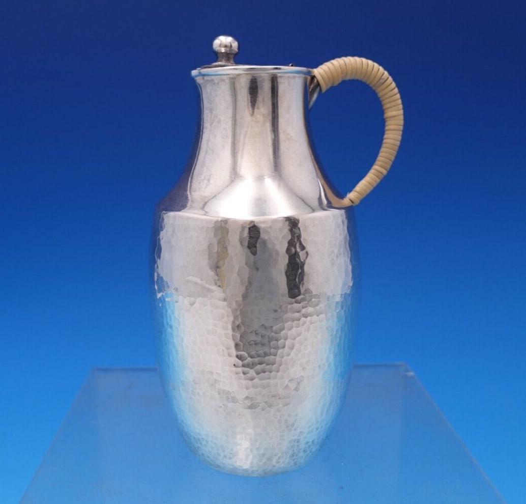 Hand Hammered Chinese Sterling Silver Cream Pitcher 4.5": Hand Hammered Chinese Sterling Silver Cream Pitcher 4.5" This exquisite Chinese cream pitcher is crafted from sterling silver and features a stunning hand-hammered finish, complemented by a faux bambo