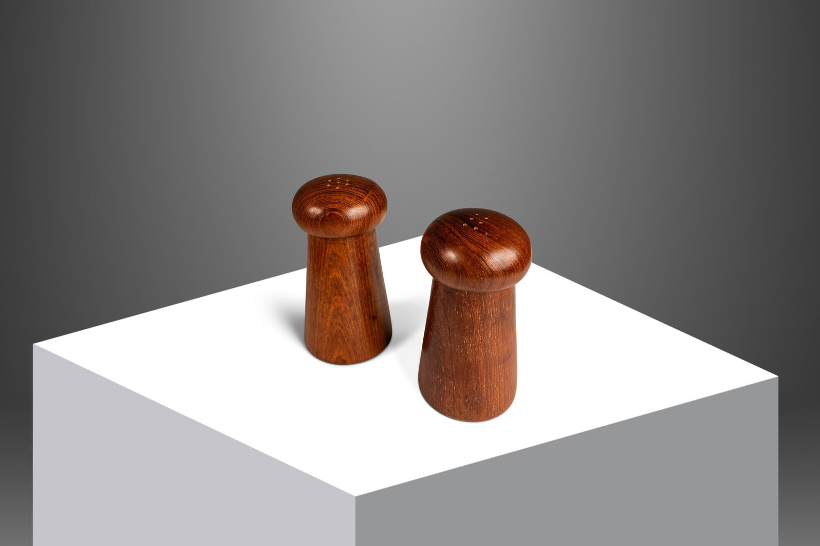 Danish Modern Hand-Carved Teak Salt and Pepper Shakers 1970s: Danish Modern Hand-Carved Teak Salt and Pepper Shakers 1970s This charming set of Mid-Century Danish Modern salt and pepper shakers is hand-carved from solid Burmese teak, showcasing exceptional wood