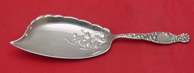 Whiting Heraldic Sterling Silver Ice Cream Server 10 1/8 Fancy: Whiting Heraldic Sterling Silver Ice Cream Server 10 1/8 Fancy Indulge in serving elegance with this exquisite ice cream server from the Heraldic pattern by Whiting. Crafted from high-quality sterling