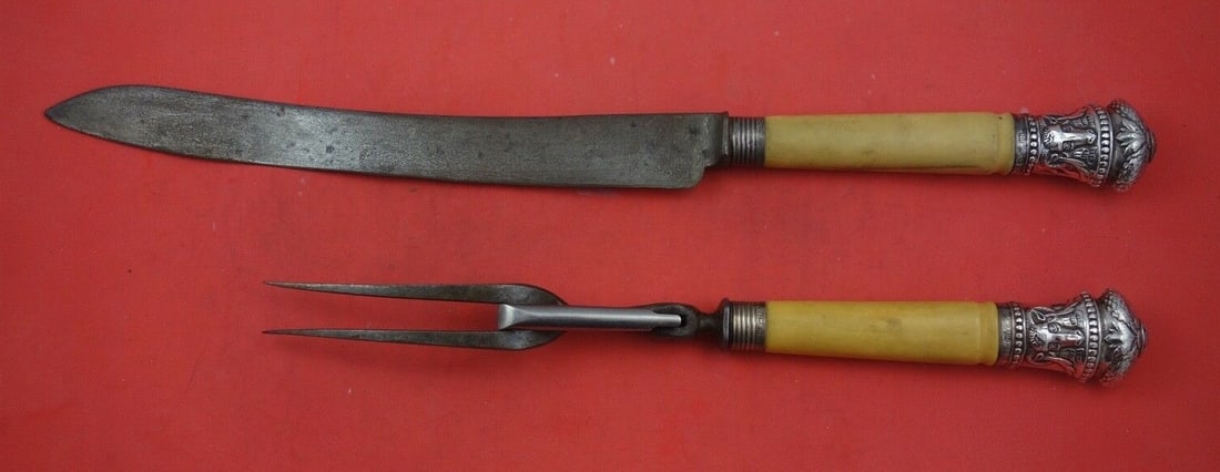 Unknown Pattern Sterling Silver Roast Carving Set 2-Piece with Faux Ivory Handles: Unknown Pattern Sterling Silver Roast Carving Set 2-Piece with Faux Ivory Handles This elegant Sterling Silver Roast Carving Set features a knife measuring 14 1/4" and a fork measuring 10". The set is