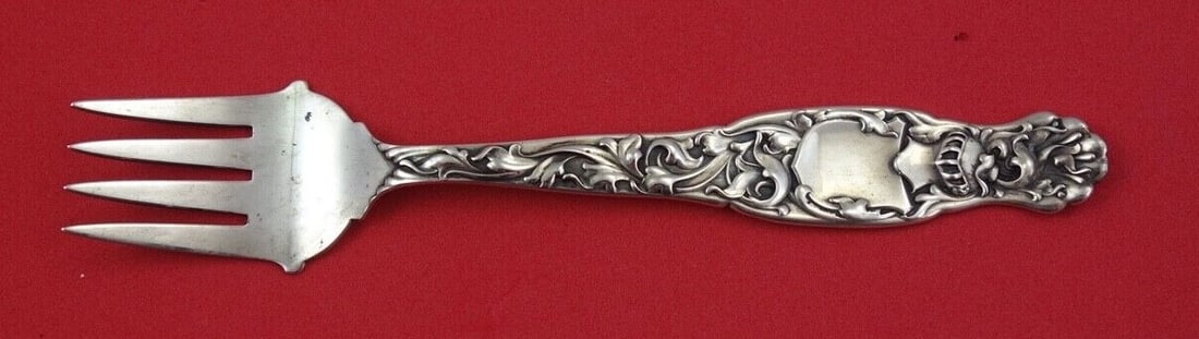 Whiting Heraldic Sterling Silver Fork 5.5" Antique 1850-1899: Whiting Heraldic Sterling Silver Fork 5.5" Antique 1850-1899 This exquisite 5 1/2" fork from the Heraldic pattern by Whiting is a captivating addition to any collection. Crafted from sterling silver,