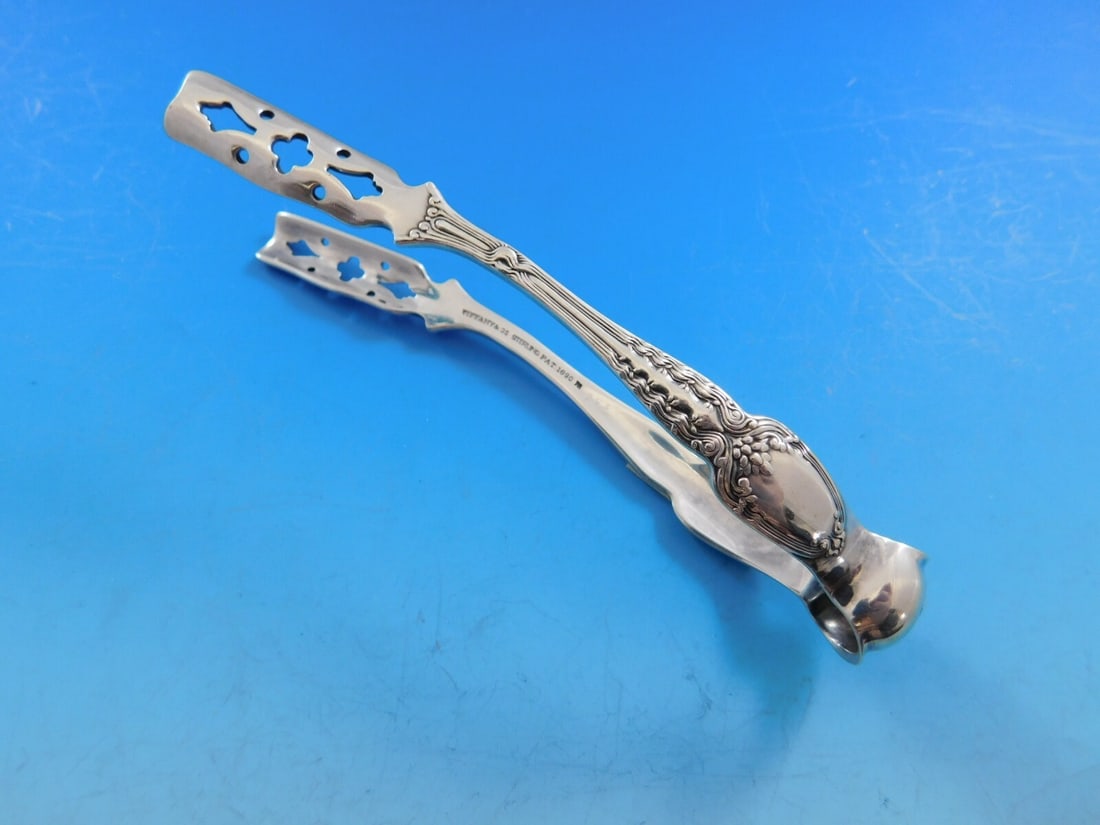 Tiffany & Co. Broom Corn Sterling Silver Asparagus Tongs 4 3/4" Monogrammed: Tiffany & Co. Broom Corn Sterling Silver Asparagus Tongs 4 3/4" Monogrammed Add elegance to your dining experience with these stunning individual asparagus tongs from Tiffany & Co., crafted in the exq