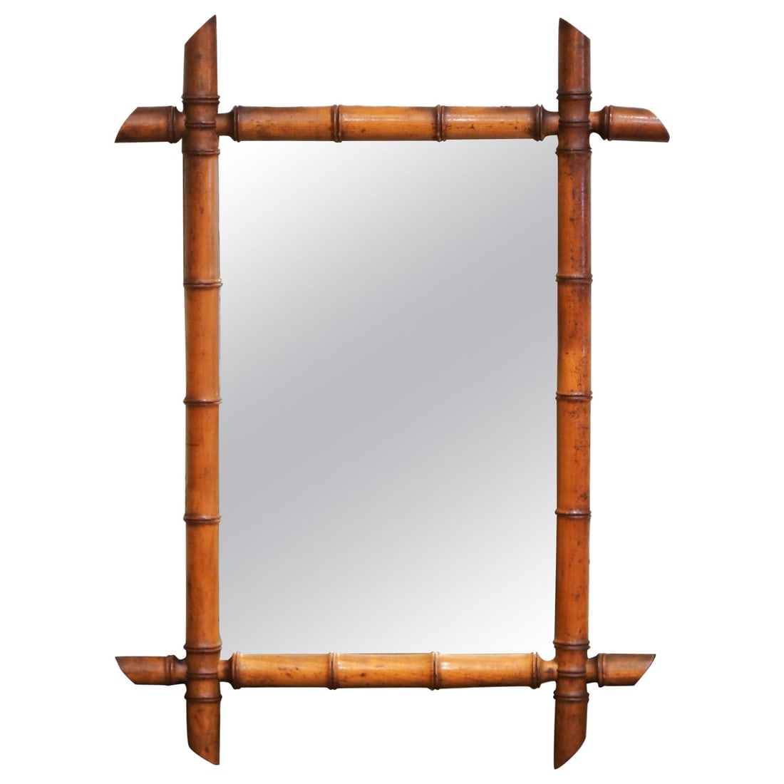 Antique 20th Century French Hand-Carved Walnut Faux Bamboo Mirror: Antique 20th Century French Hand-Carved Walnut Faux Bamboo Mirror This exquisite Early 20th Century French wall mirror showcases a beautiful hand-carved walnut frame designed to resemble faux bamboo.