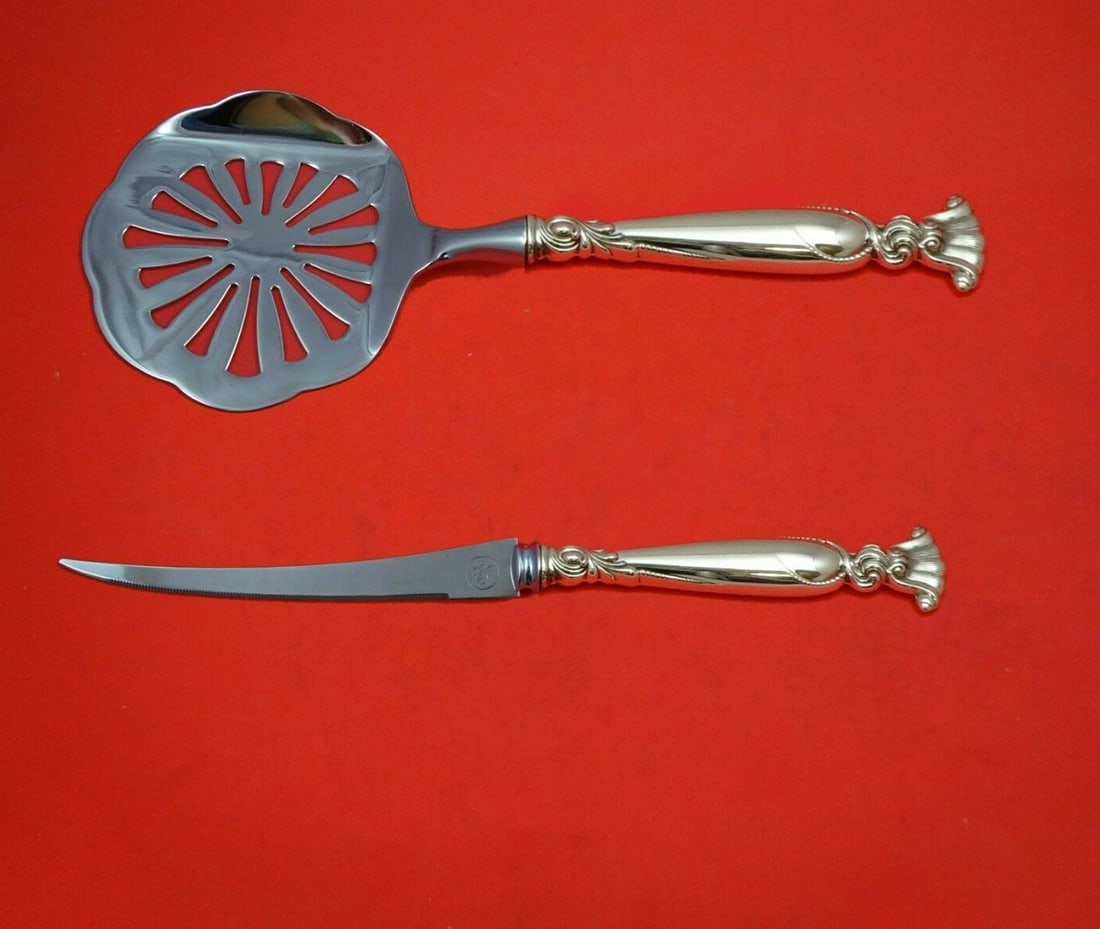 Wallace Romance of the Sea Sterling Silver Tomato Serving Set 2pc: Wallace Romance of the Sea Sterling Silver Tomato Serving Set 2pc Enhance your dining experience with this exquisite 2-piece Tomato Serving Set from the Romance of the Sea pattern by Wallace. Crafted