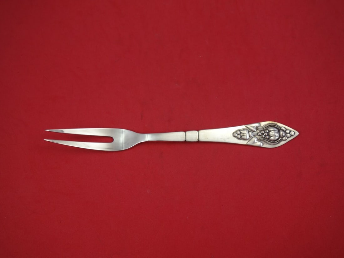Georg Jensen Fuchsia Sterling Silver 2-Tine Cold Meat Fork 8 1/4": Georg Jensen Fuchsia Sterling Silver 2-Tine Cold Meat Fork 8 1/4" This exquisite cold meat fork features a classic 2-tine design from the renowned Fuchsia pattern by Georg Jensen. Crafted from high-qu
