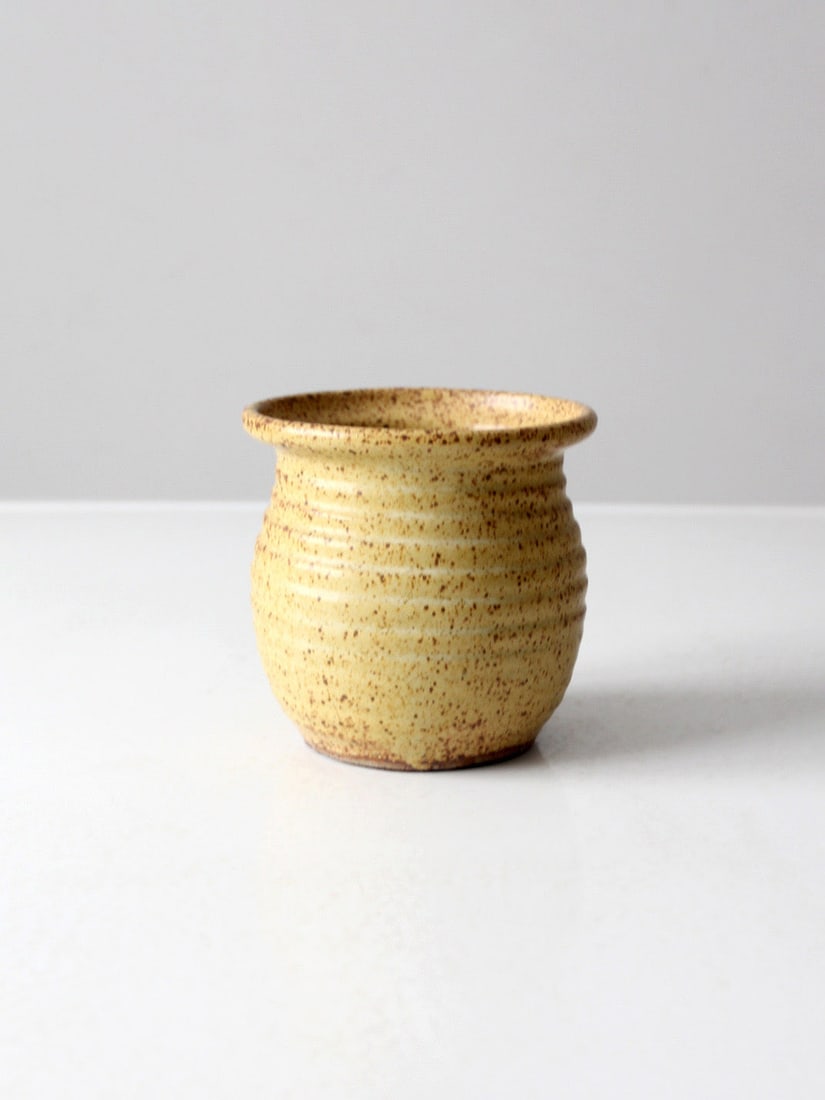 Vintage Mustard Yellow Studio Pottery Vase 5.125" Diameter: Vintage Mustard Yellow Studio Pottery Vase 5.125" Diameter This vintage studio pottery vase features a stunning mustard yellow glaze with a subtle speckled finish, showcasing a unique handmade form. I
