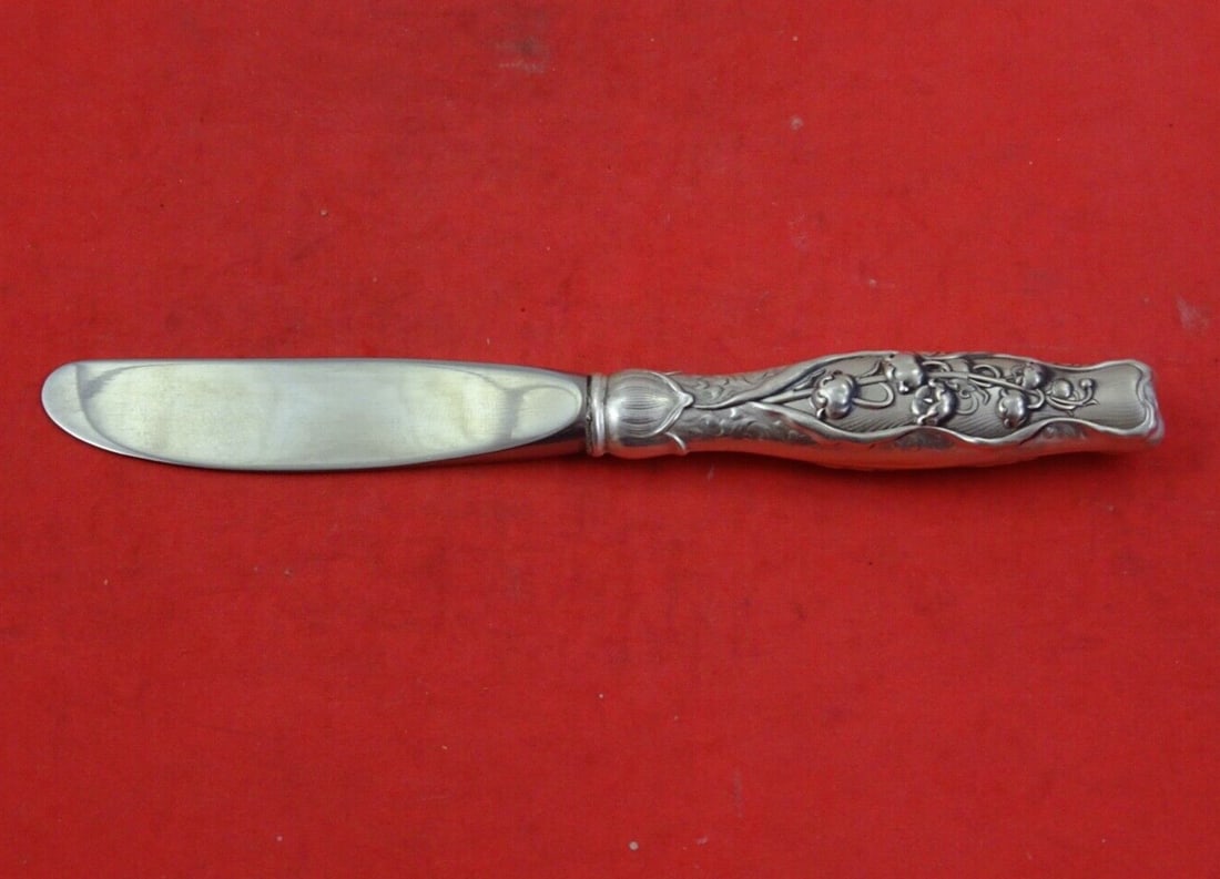 Rare Whiting Sterling Silver 6" Lily of the Valley Butter Spreader: Rare Whiting Sterling Silver 6" Lily of the Valley Butter Spreader This exquisite butter spreader features the enchanting "Lily of the Valley" pattern by Whiting, crafted from high-quality sterling