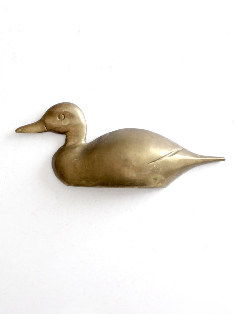 Mid-Century Vintage Brass Duck Wall Sculpture 10 inch Accent: Mid-Century Vintage Brass Duck Wall Sculpture 10 inch Accent Enhance your living space with this vintage brass duck wall hanging, showcasing sleek modern lines and a beautiful natural patina. This mid