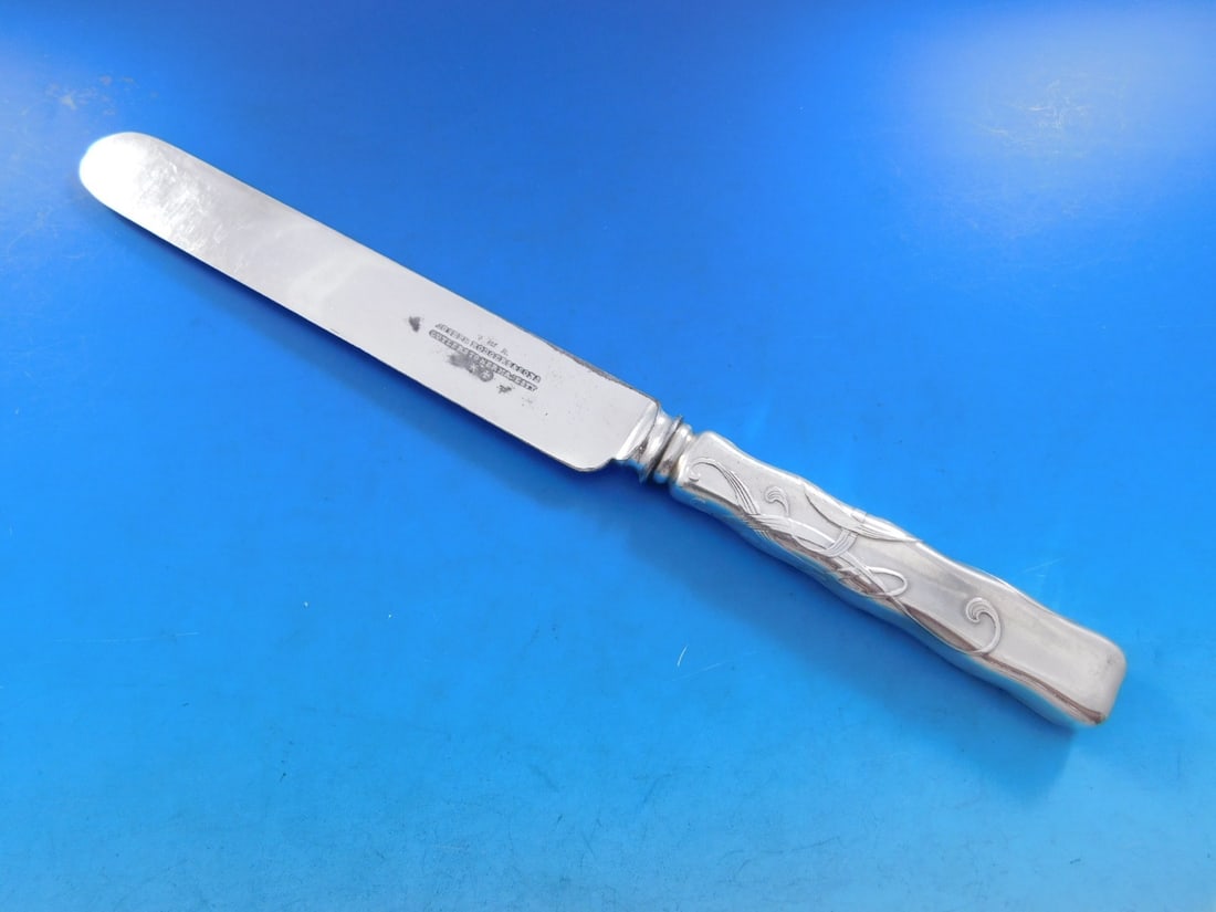 Tiffany & Co. Lap Over Edge Sterling Silver Dinner Knife 10.5": Tiffany & Co. Lap Over Edge Sterling Silver Dinner Knife 10.5" This exquisite dinner knife from Tiffany & Co. showcases the Lap Over Edge pattern with a beautiful acid etched design. Crafted from ster