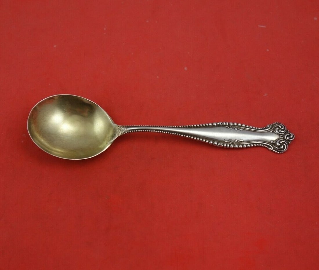 Towle Canterbury Sterling Silver Gold Washed Gumbo Soup Spoon 6 3/4": Towle Canterbury Sterling Silver Gold Washed Gumbo Soup Spoon 6 3/4" This exquisite gumbo soup spoon is crafted from sterling silver and features a beautiful gold wash, enhancing its elegance. Designe