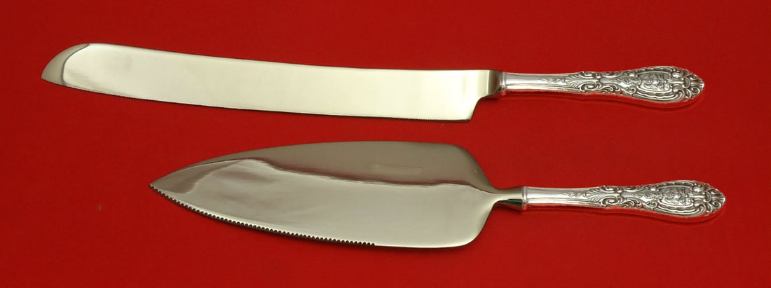 Easterling Southern Grandeur Sterling Silver Wedding Cake Set 2pc: Easterling Southern Grandeur Sterling Silver Wedding Cake Set 2pc This exquisite Southern Grandeur wedding cake set, crafted by Easterling, features a stunning design in sterling silver. The set inclu