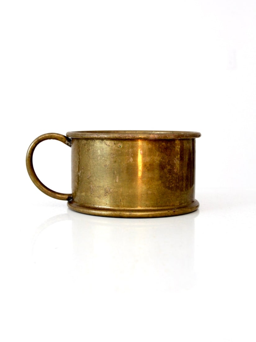 Late 19th Century Brass Handled Shaving Bowl Decorative Accent Piece: Late 19th Century Brass Handled Shaving Bowl Decorative Accent Piece This antique brass shaving bowl from the late 19th to early 20th century features a traditional handled design with a softly rolled