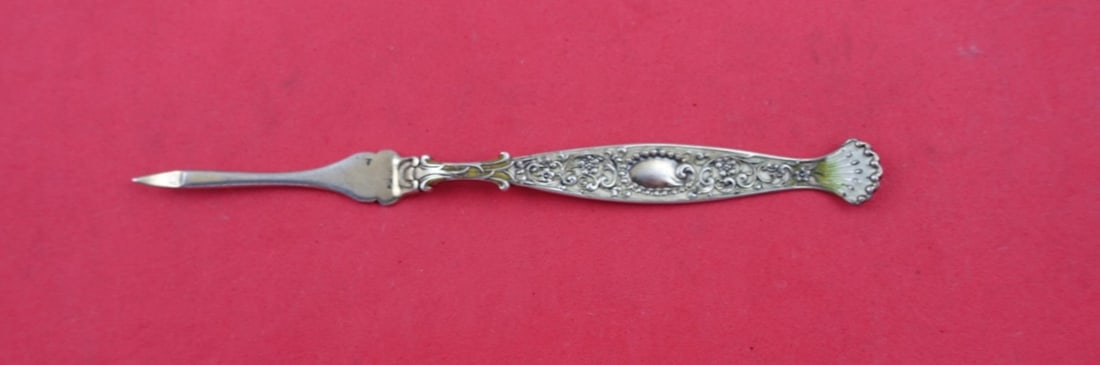 Whiting Hyperion Sterling Silver Nut Pick with Enamel 5.25": Whiting Hyperion Sterling Silver Nut Pick with Enamel 5.25" This exquisite nut pick is crafted from high-quality sterling silver and features the elegant Hyperion pattern by Whiting. It is adorned wit