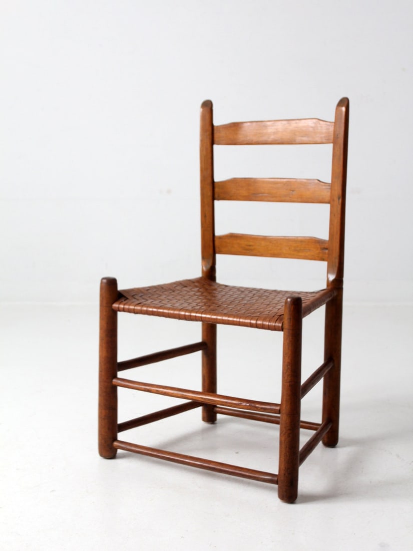 Vintage Antique Ladder Back Chair with Herringbone Woven Seat: Vintage Antique Ladder Back Chair with Herringbone Woven Seat This antique ladder back chair showcases a classic design with a low herringbone woven caned seat, perfect for adding a touch of vintage c