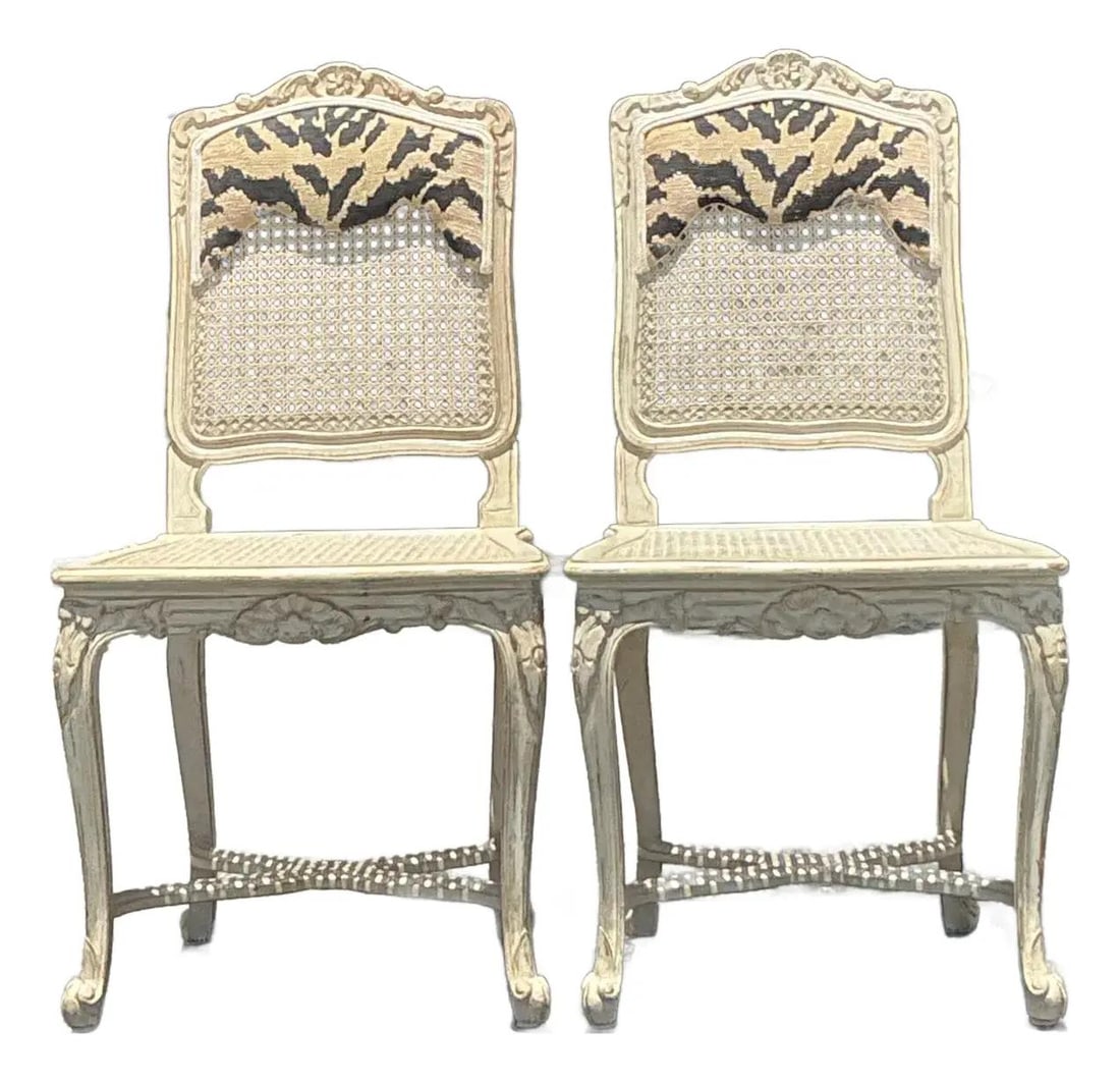 Vintage Regency Cane Side Chairs Pair in Distressed Cream Finish: Vintage Regency Cane Side Chairs Pair in Distressed Cream Finish Embrace the elegance of a bygone era with this stunning pair of Vintage Regency Cane Side Chairs. Crafted with beautifully carved wood