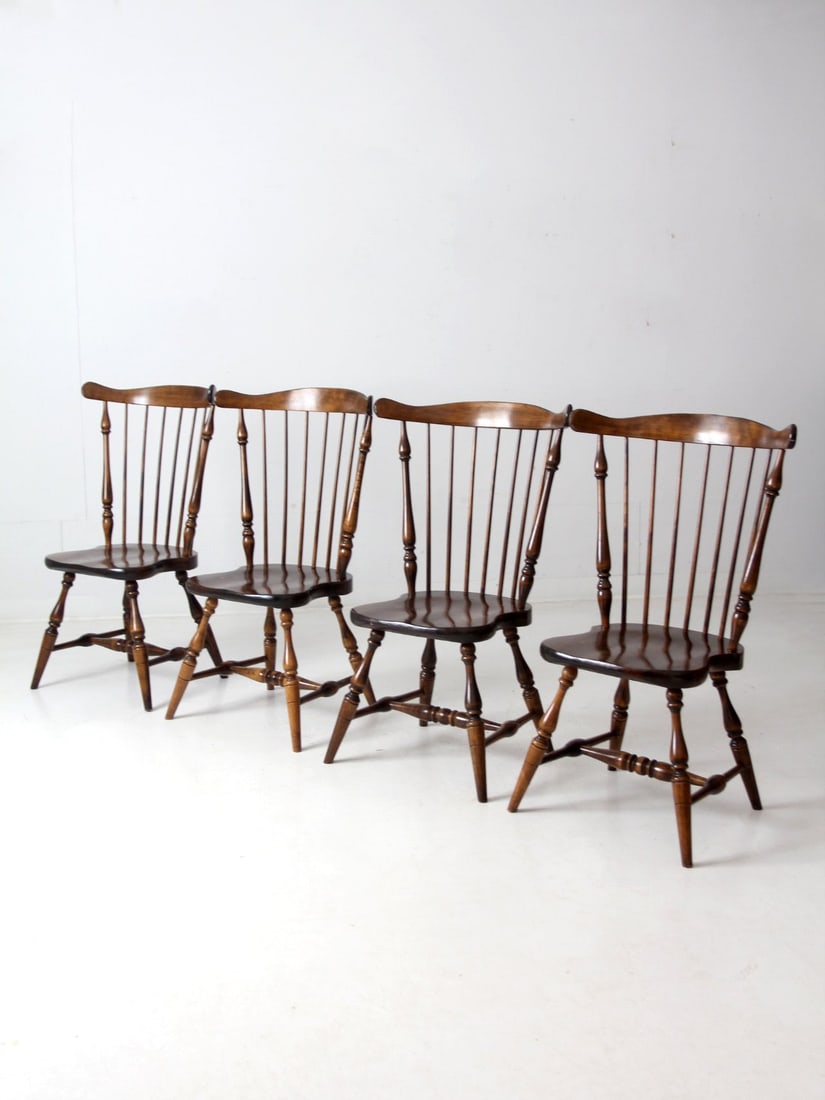 Set of 4 Vintage American Windsor Wood Dining Chairs: Set of 4 Vintage American Windsor Wood Dining Chairs This set of 4 vintage American Windsor wood chairs embodies timeless elegance with their distinctive spindle backs, curved seats, and turned legs,