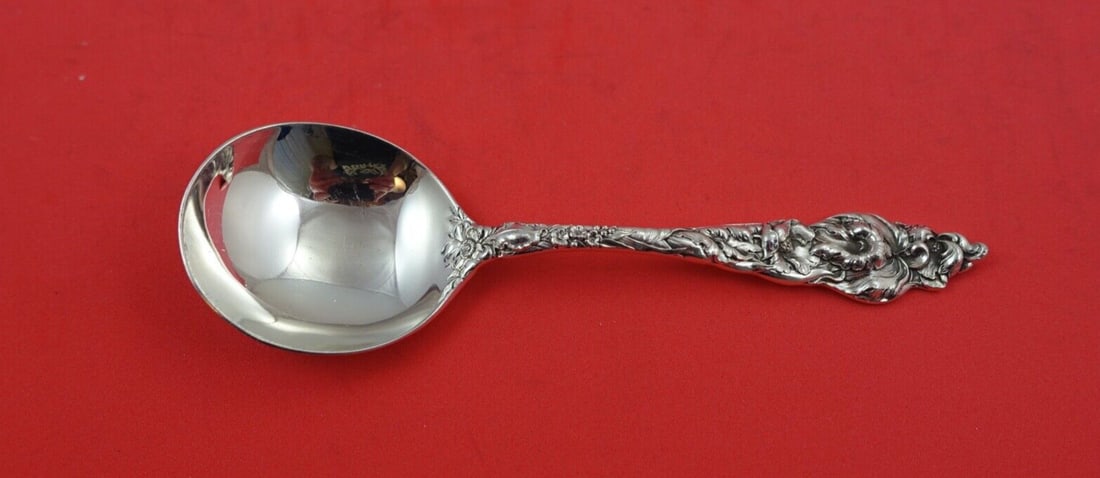 Reed & Barton Les Six Fleurs Sterling Silver Cream Soup Spoon 6 1/4": Reed & Barton Les Six Fleurs Sterling Silver Cream Soup Spoon 6 1/4" This exquisite cream soup spoon features the elegant Les Six Fleurs pattern by Reed & Barton, crafted from high-quality sterling si