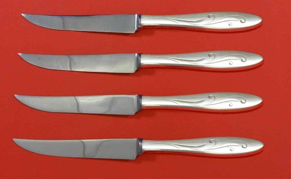 Towle Sterling Silver Awakening Steak Knife Set 4pc Custom 8 1/2: Towle Sterling Silver Awakening Steak Knife Set 4pc Custom 8 1/2 Enhance your dining experience with this exquisite 4-piece steak knife set from Towle, featuring the elegant "Awakening" pattern. Each