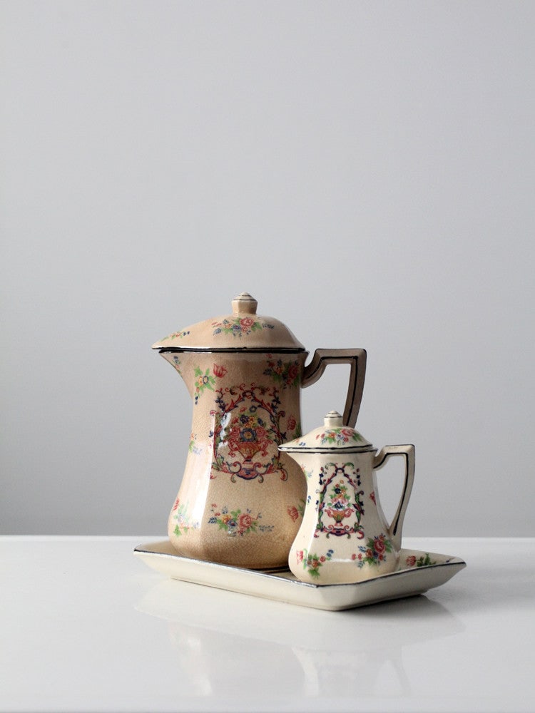 Vintage Japanese Porcelain Tea Set by Tashiro Shoten Ltd with Floral Design: Vintage Japanese Porcelain Tea Set by Tashiro Shoten Ltd with Floral Design This vintage Japanese porcelain tea set, crafted before the 1950s, features a teapot, creamer, and tray, all adorned with el