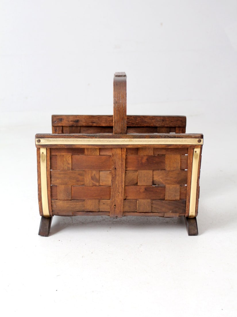 Mid Century Splint Weave Basket with Bentwood Handle and Brass Trim: Mid Century Splint Weave Basket with Bentwood Handle and Brass Trim This charming mid-century splint weave basket features a bentwood handle and brass trim, seamlessly integrating outdoor elements int