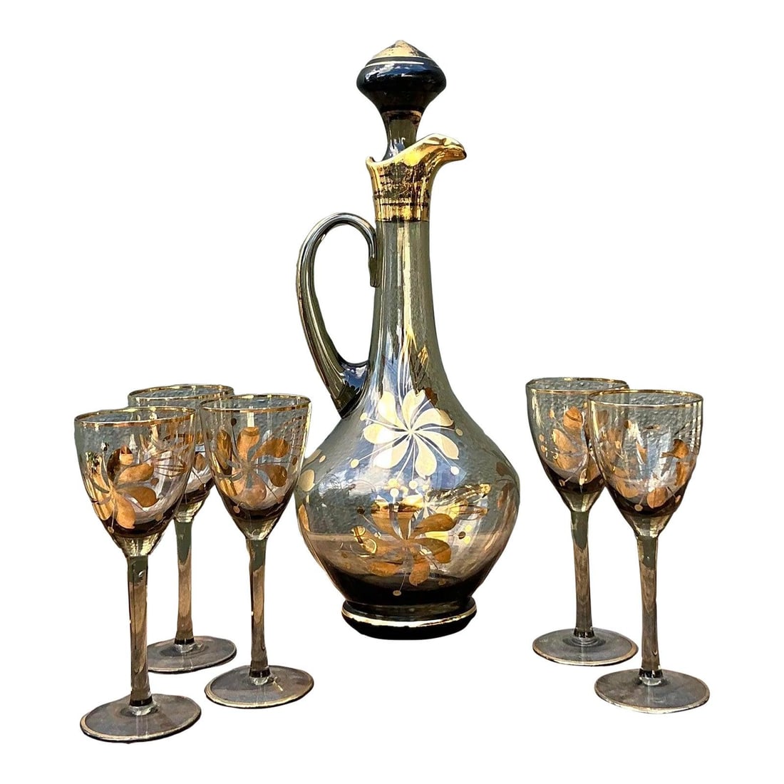 Vintage Hungarian Smoked Topaz Gilt Decanter Set of 6: Vintage Hungarian Smoked Topaz Gilt Decanter Set of 6 Elevate your home bar with this exquisite Vintage Hungarian Gilt Floral Decanter Set. This opulent collection features a gracefully designed decan