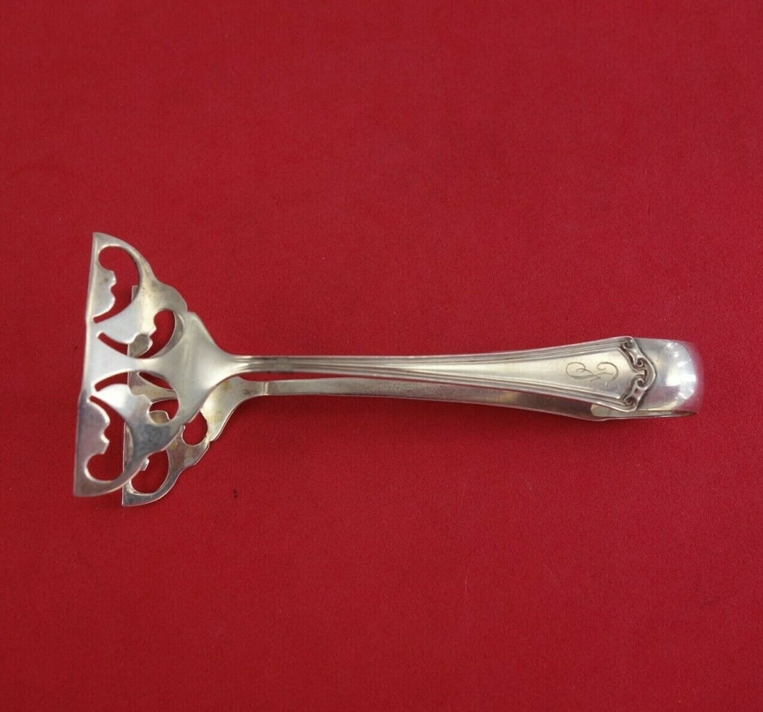 Baker-Manchester Roanoke Sterling Silver Sardine Tong 4 1/8 Inch: Baker-Manchester Roanoke Sterling Silver Sardine Tong 4 1/8 Inch Discover the timeless elegance of the Roanoke Sardine Tong by Baker-Manchester, crafted from high-quality sterling silver. This exquisi