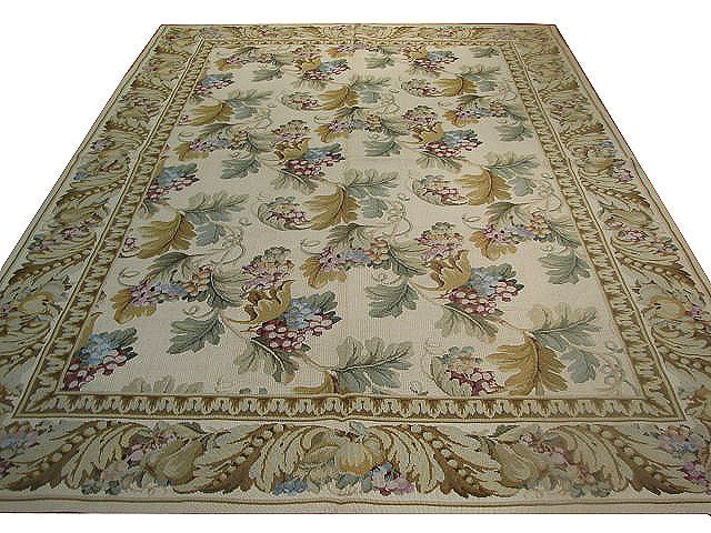 6' x 9' Ivory Hand-Knotted Needlepoint Area Rug: 6' x 9' Ivory Hand-Knotted Needlepoint Area Rug Free continental US Shipping Elevate your home decor with the elegant 6' x 9' Ivory Double Knot Needlepoint Rug. This exquisite area rug features a trad