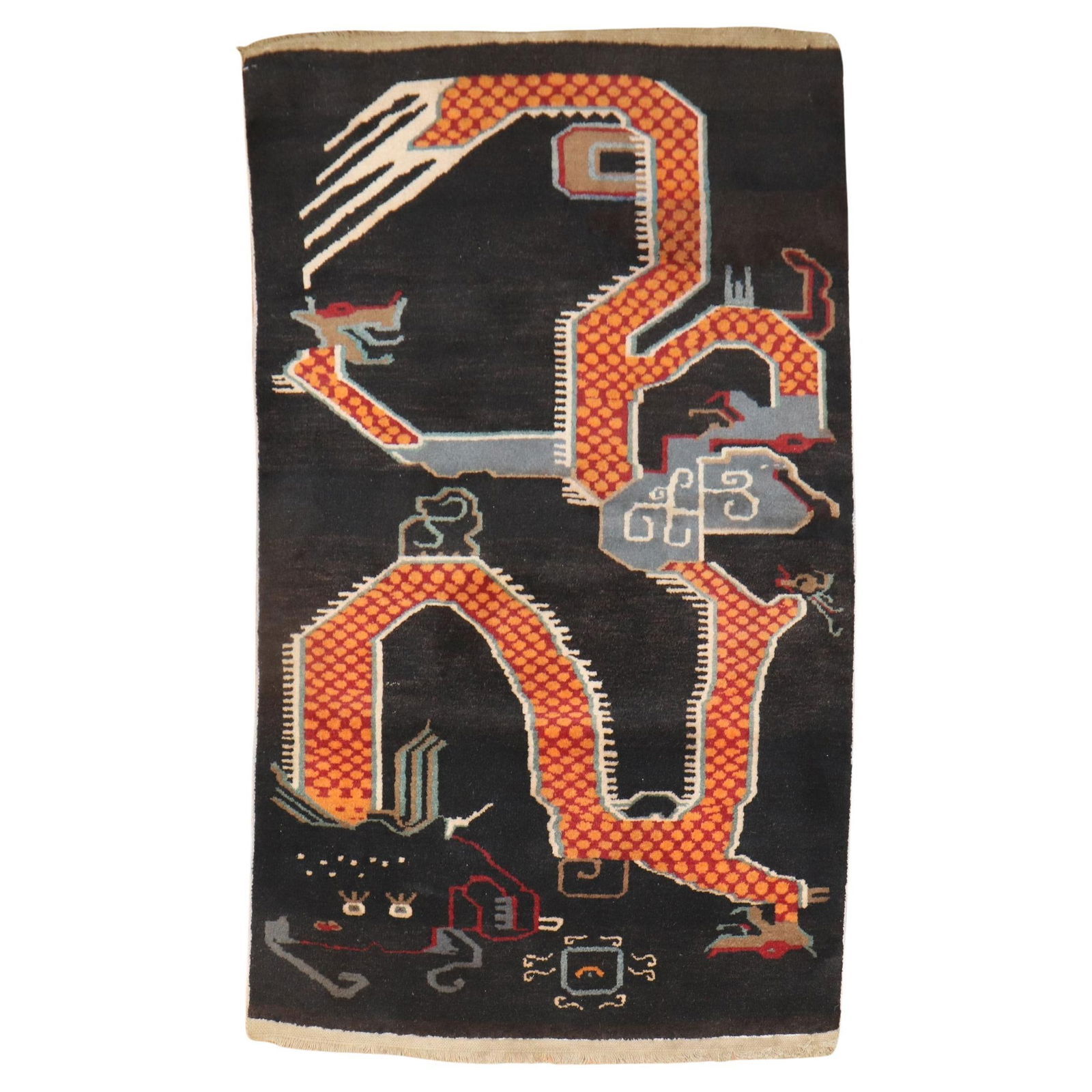 Art Deco Tibetan Scatter Carpet Hand-Woven Wool Orange Dragon 38x63 in: Art Deco Tibetan Scatter Carpet Hand-Woven Wool Orange Dragon 38x63 in This vintage Tibetan scatter carpet showcases a striking Art Deco design featuring a large orange dragon. Hand-woven from high-qu