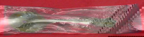 International Sterling Silver Angelique Serving Spoon 8 3/8 New: International Sterling Silver Angelique Serving Spoon 8 3/8 New This exquisite serving spoon, measuring 8 3/8 inches, features the elegant Angelique pattern from International Sterling. Crafted from g