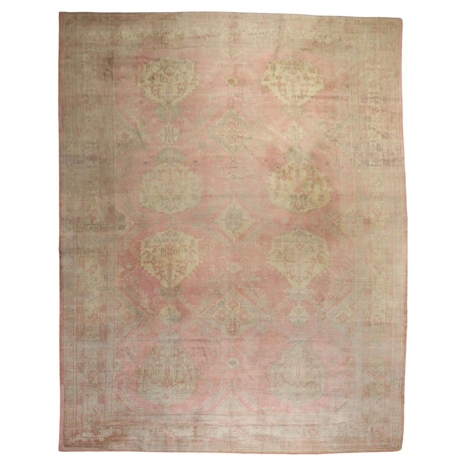 Zabihi Collection Oversize Pink Turkish Oushak Wool Rug 12'2 x 17'6 Hand-Knotted: Zabihi Collection Oversize Pink Turkish Oushak Wool Rug 12'2 x 17'6 Hand-Knotted Discover the timeless elegance of this pink oversize Turkish Oushak rug, an exquisite piece from the early 20th century