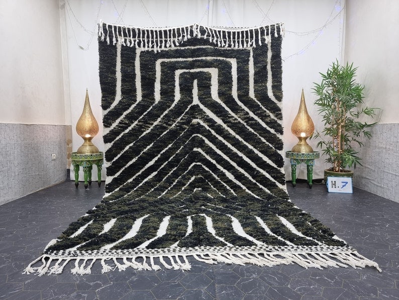 Authentic Handwoven Black Moroccan Berber Wool Rug with Engraved Design: Authentic Handwoven Black Moroccan Berber Wool Rug with Engraved Design Experience the beauty of this special authentic soft black handmade Moroccan Berber wool area rug. This exquisite piece features
