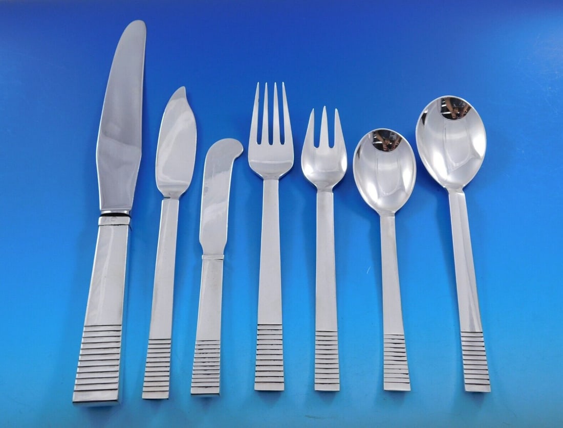 Georg Jensen Pyramid Sterling Silver Flatware Set 64 pcs for 8: Georg Jensen Pyramid Sterling Silver Flatware Set 64 pcs for 8 Experience the elegance of the "Parallel" flatware set by Georg Jensen, designed by Oscar Gunlach-Pedersen in 1931. This remarkable set,