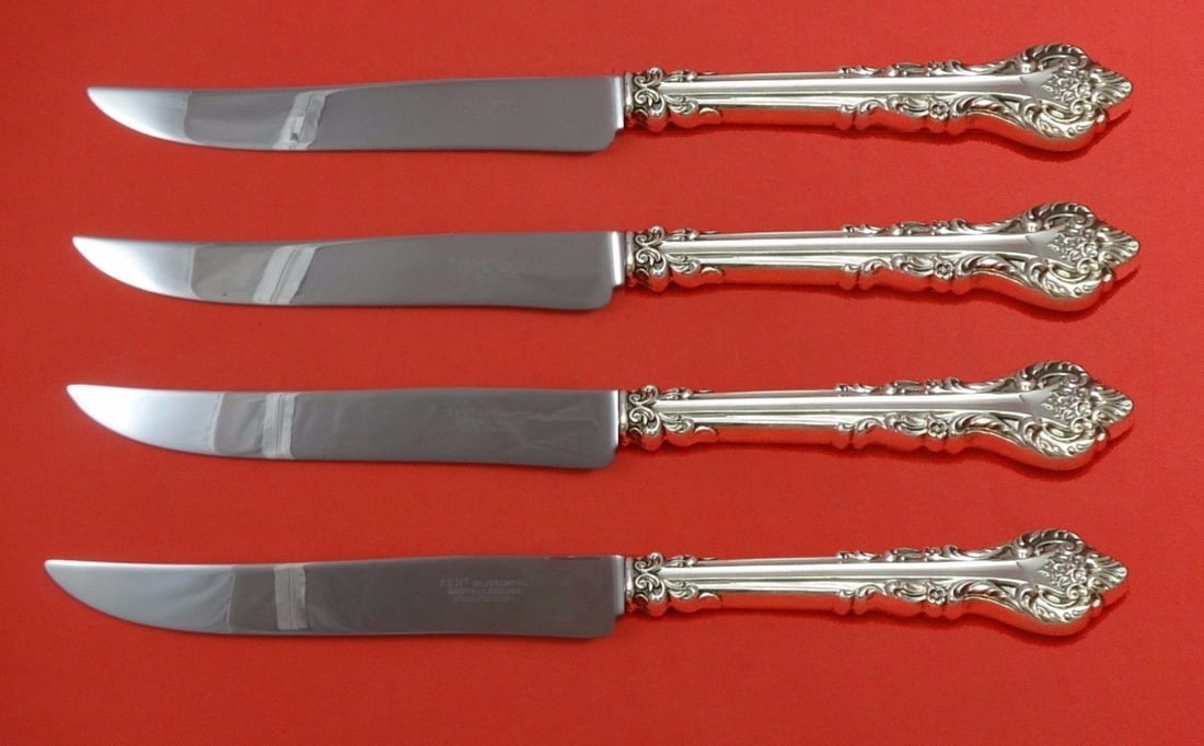 International Sterling Silver Masterpiece Texas Sized Steak Knife Set 4-Piece: International Sterling Silver Masterpiece Texas Sized Steak Knife Set 4-Piece Elevate your dining experience with this exquisite 4-piece Silver Masterpiece Steak Knife Set by International Sterling. E