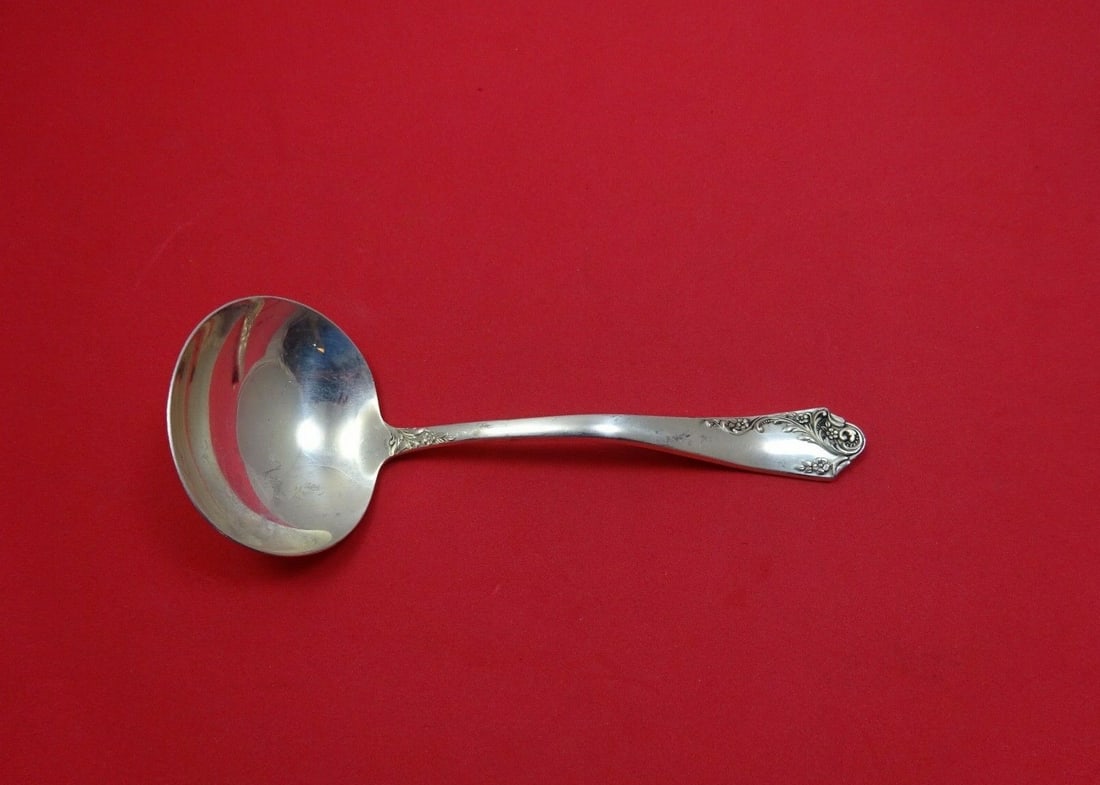 Amston Breath of Spring II Sterling Silver Gravy Ladle 6.25": Amston Breath of Spring II Sterling Silver Gravy Ladle 6.25" Introducing the Breath of Spring II Gravy Ladle, a beautiful serving piece crafted from high-quality sterling silver. This ladle, measuring