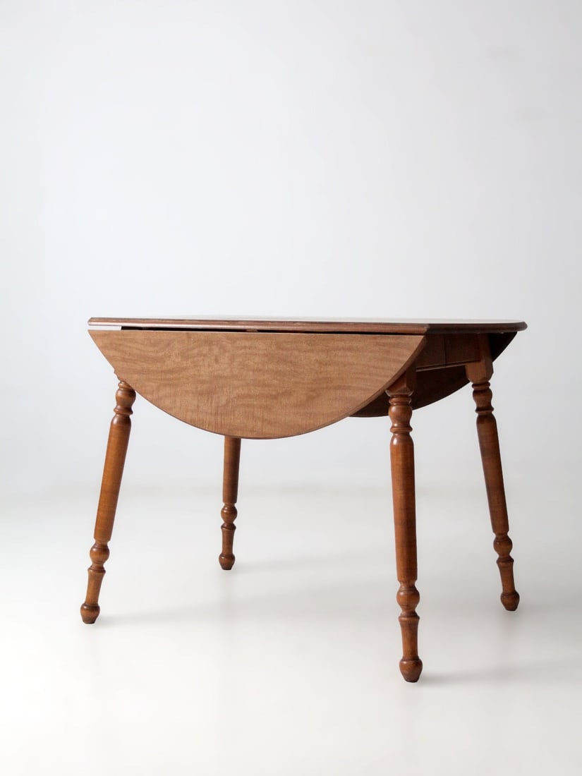 Drop Leaf Dining Table With Extensions by Dearborn Co Mid-Century Design: Drop Leaf Dining Table With Extensions by Dearborn Co Mid-Century Design This mid-century dining table by Dearborn Co features classic turned legs and a versatile design with drop leaves and two exten