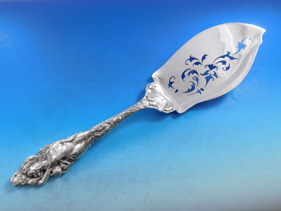 Reed and Barton Love Disarmed Sterling Silver Pierced Fish Server 12.5": Reed and Barton Love Disarmed Sterling Silver Pierced Fish Server 12.5" Presenting the exquisite Love Disarmed Fish Server by Reed and Barton, crafted from high-quality sterling silver. This elegant s