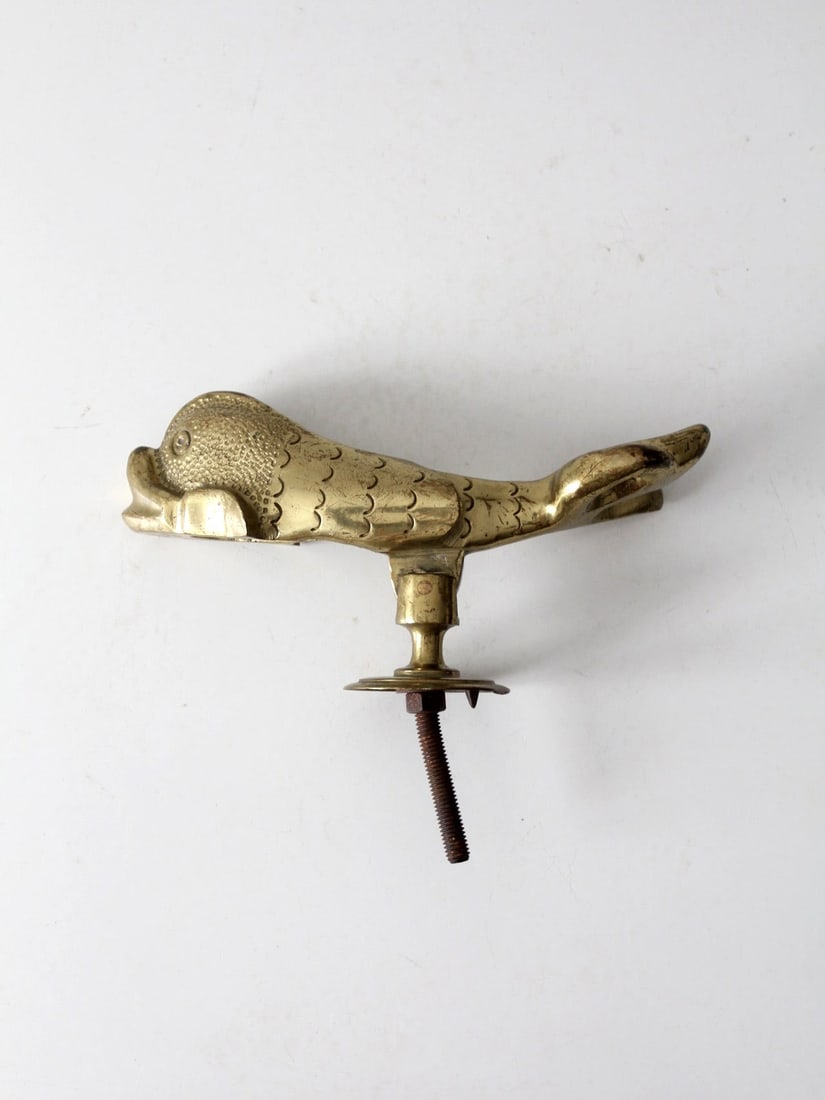 Mid-Century Maltese Brass Fish Door Knocker by F. Agius & Sons: Mid-Century Maltese Brass Fish Door Knocker by F. Agius & Sons This exquisite mid-20th-century door knocker, crafted by F. Agius & Sons in Malta, is designed in the shape of a stylized fish, showcasin