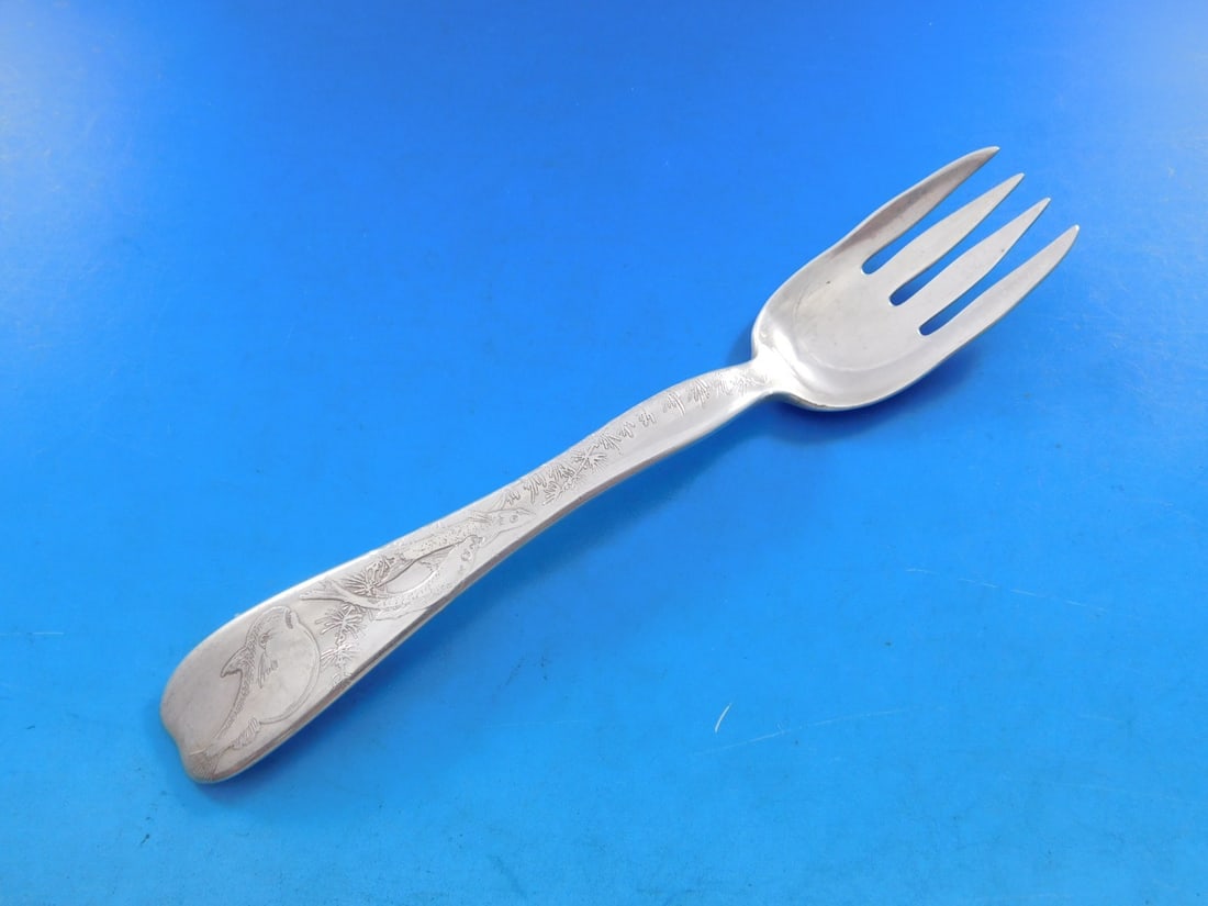 Tiffany Sterling Silver 6.5" Fish Fork Lap Over Acid Etched: Tiffany Sterling Silver 6.5" Fish Fork Lap Over Acid Etched This exquisite fish fork from Tiffany & Co. is crafted from sterling silver and features the elegant Lap Over Edge pattern. Measuring 6 1/2